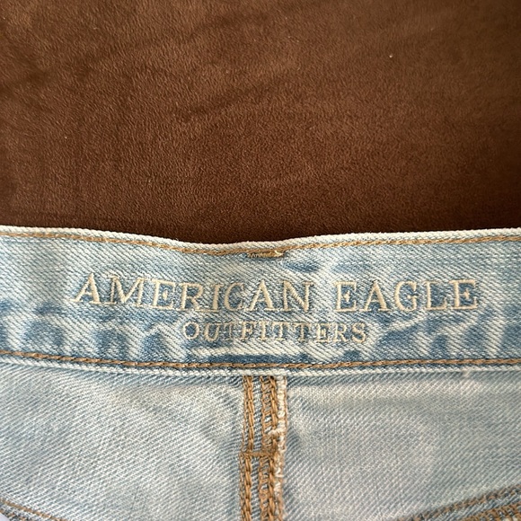 Light wash distressed denim shorts with lace detail. Size 4. - Picture 5 of 5